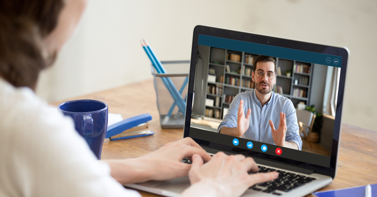 woman viewing a webinar on a laptop