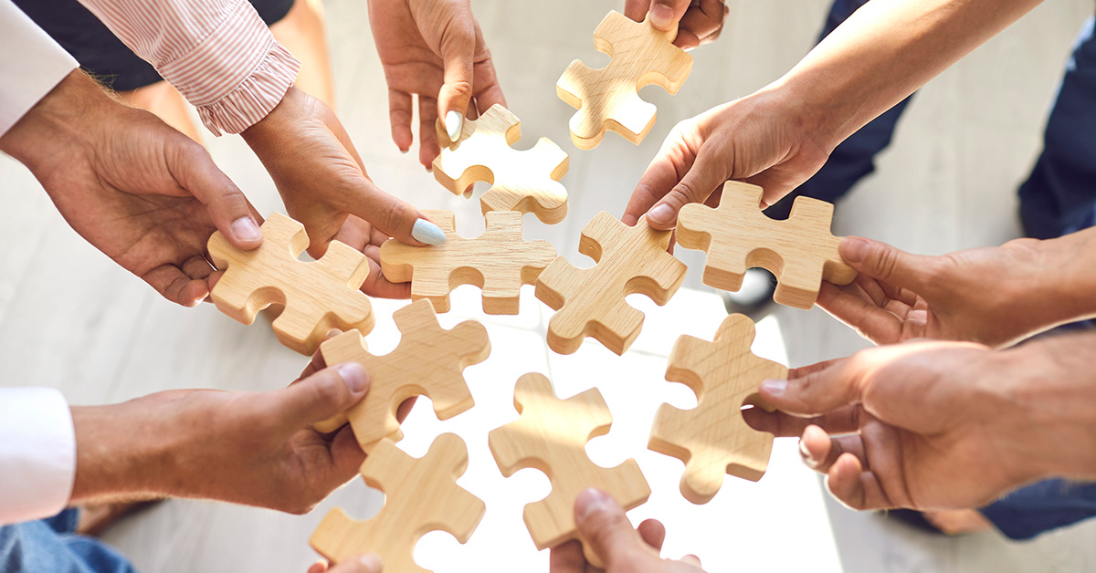 hands holding puzzle pieces