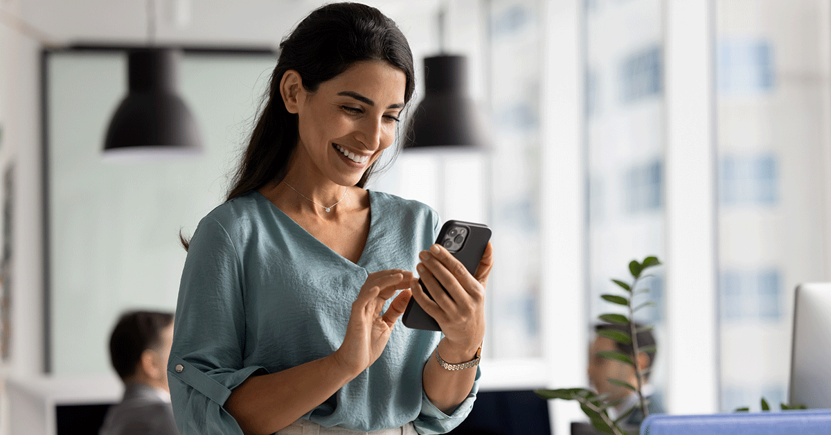 smiling woman using her phone