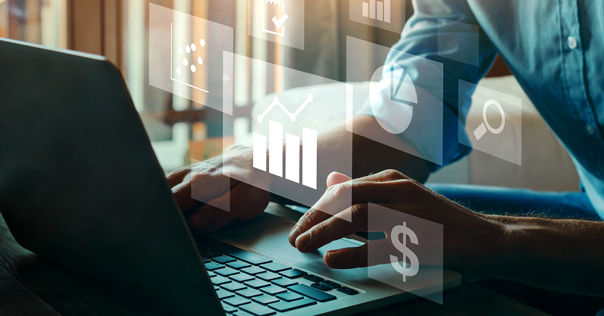 financial overlay of someone working on a laptop