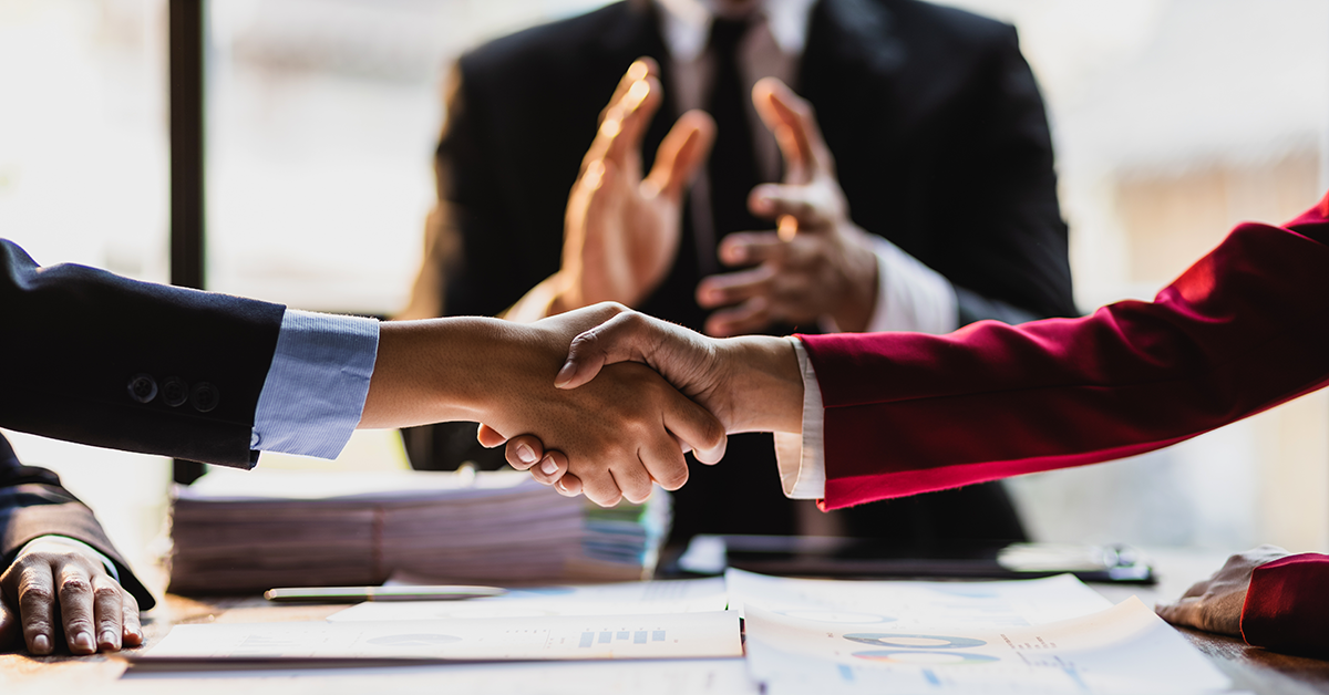 shaking hands in agreement