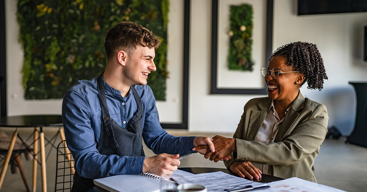 small business owner meeting with someone