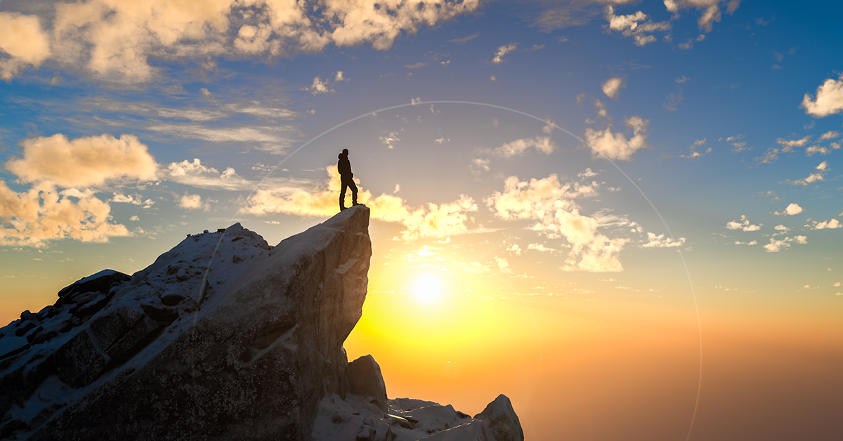 climber reaching the mountain peak