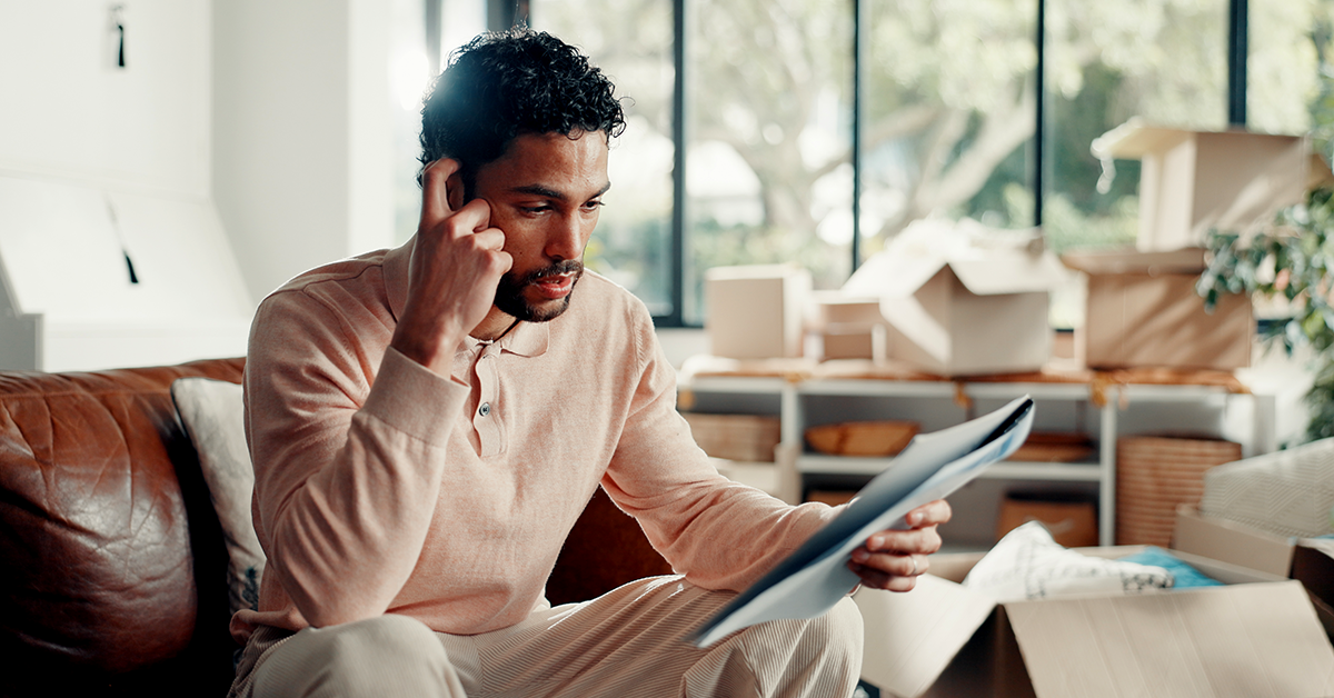 a concerned looking man on a phone
