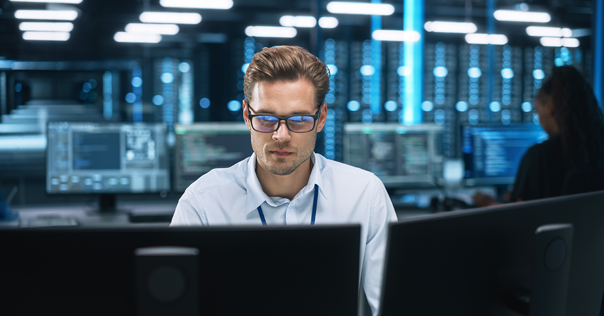 young man working in a server room
