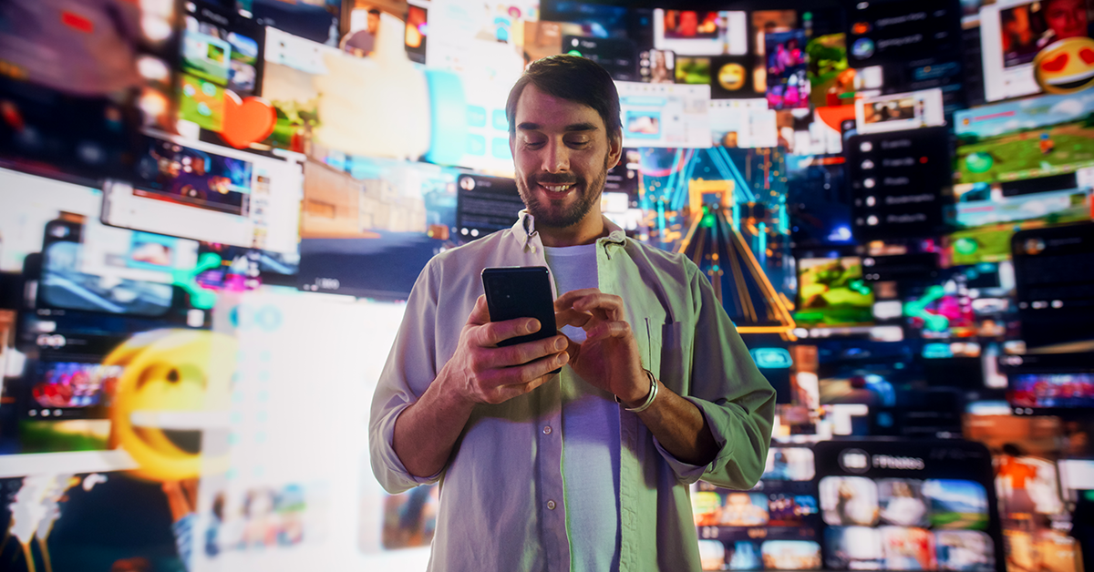 a man looking at his phone with a digital channels background
