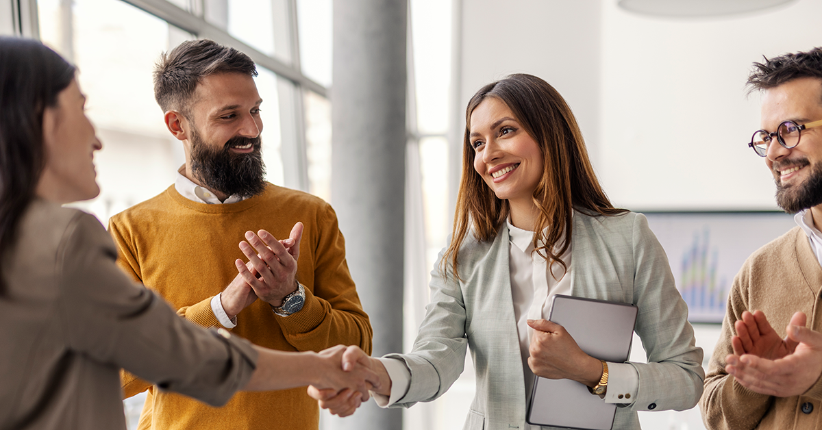 team meeting and shaking hands