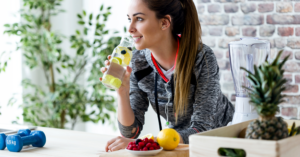 young lady enjoying a healthy snack after exercising