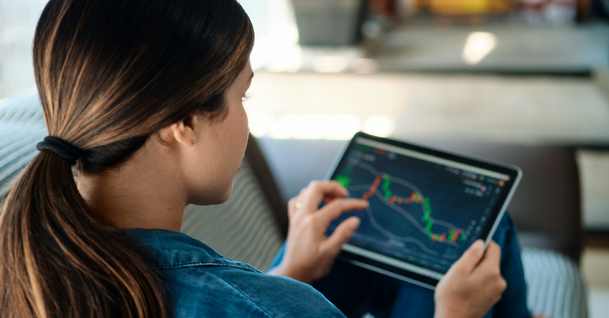 young person looking at investing options on a tablet