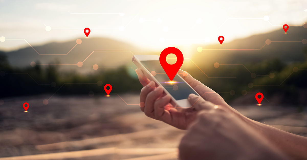 location points overlayed on someone using their phone outside