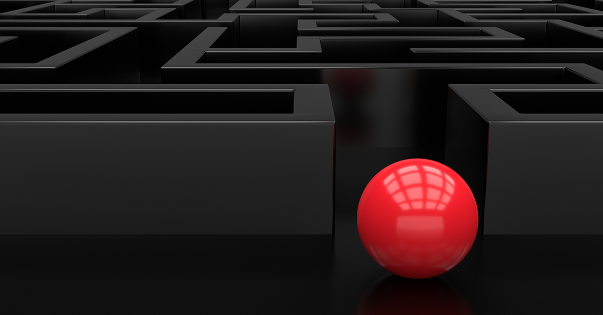 a red ball entering a maze