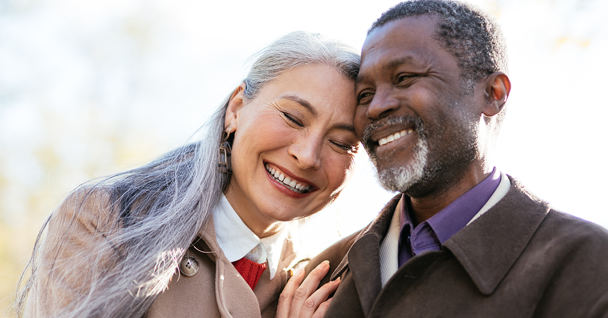 smiling older couple outside