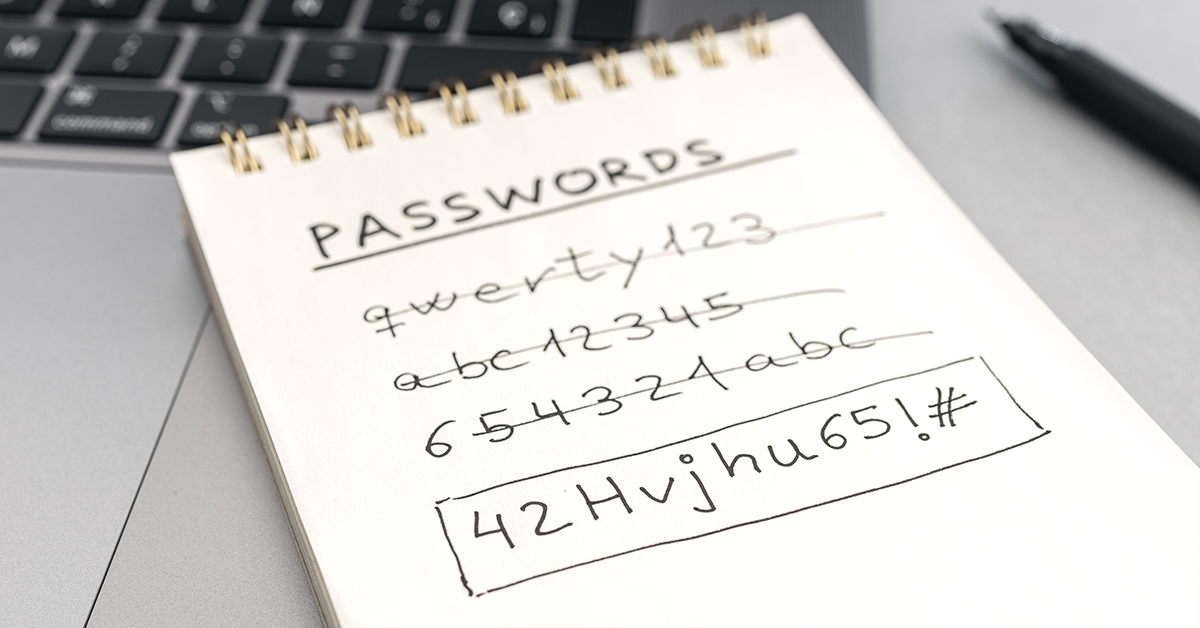 password list sitting on top of a laptop keyboard