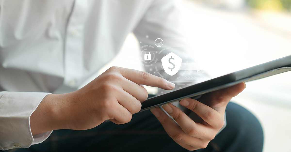 man working on a tablet with a financial overlay