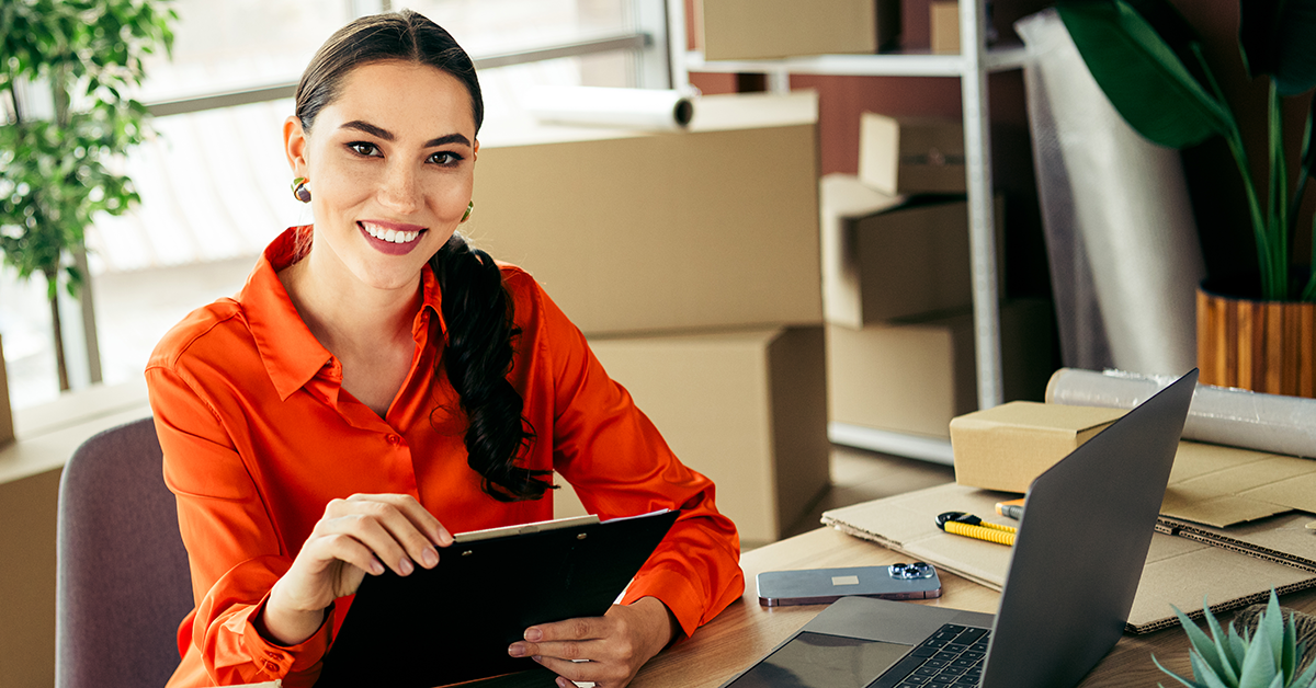 woman sitting at a desk working on a computer