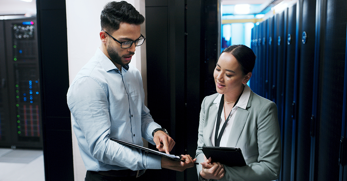 two people working in a server room
