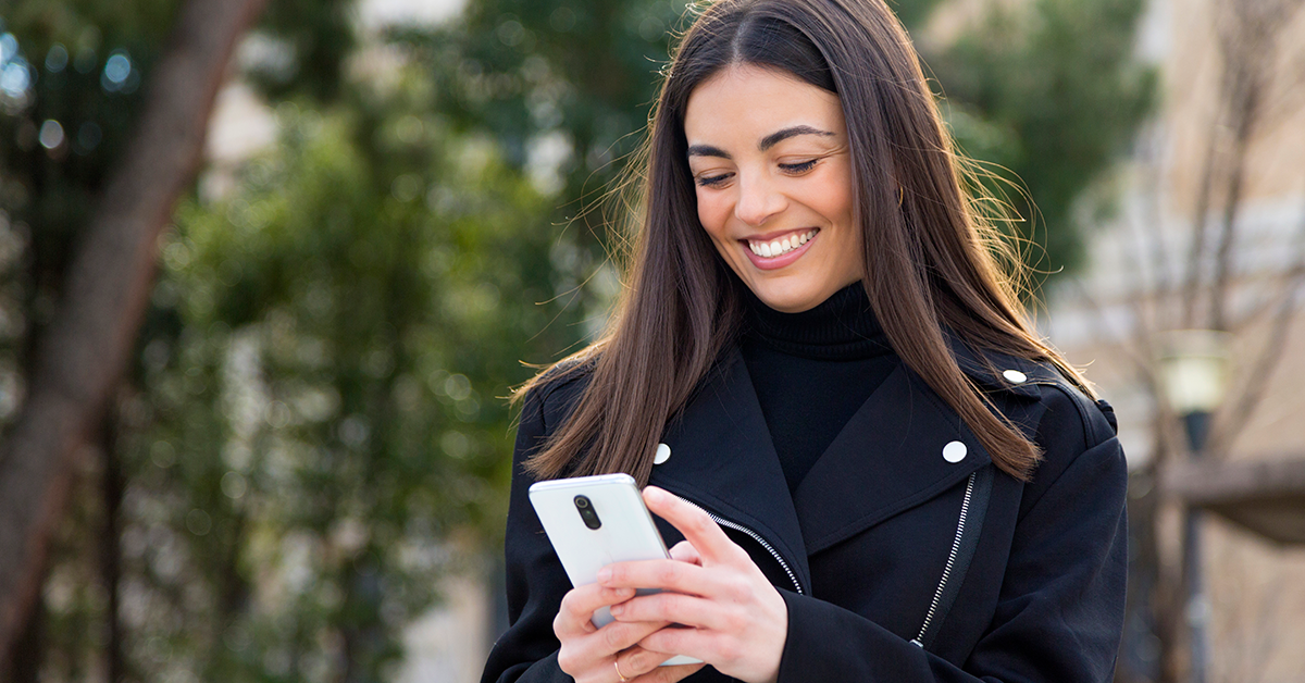woman-phone-smiling-1200x628