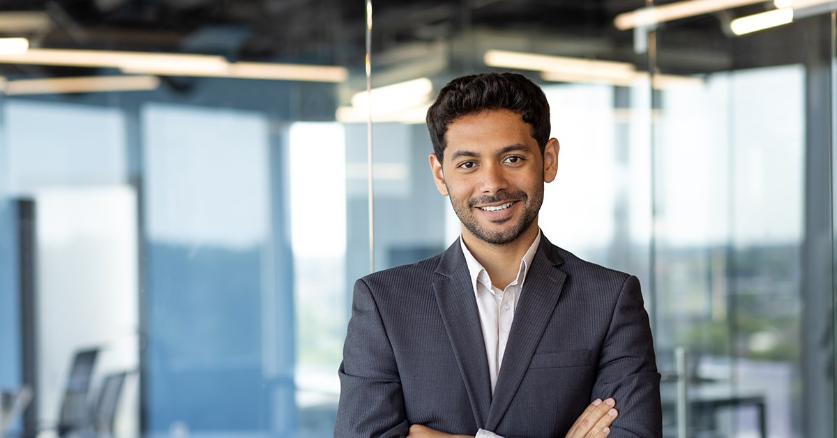 smiling executive young man in an office